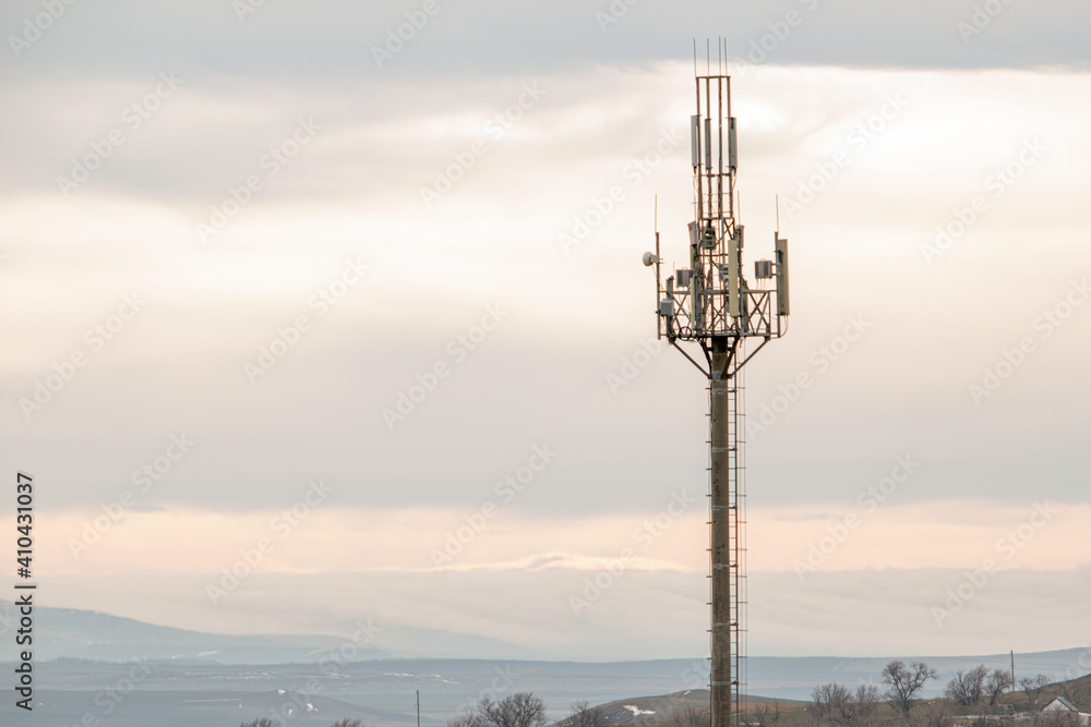 cell tower on the background of the autumn gray sky