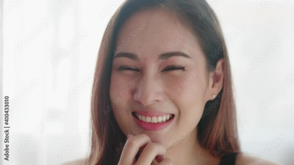 Close up of very beautiful Asian woman smiling in a very cute way and very happy Close up of very beautiful Asian woman smiling in a very cute way and very happy