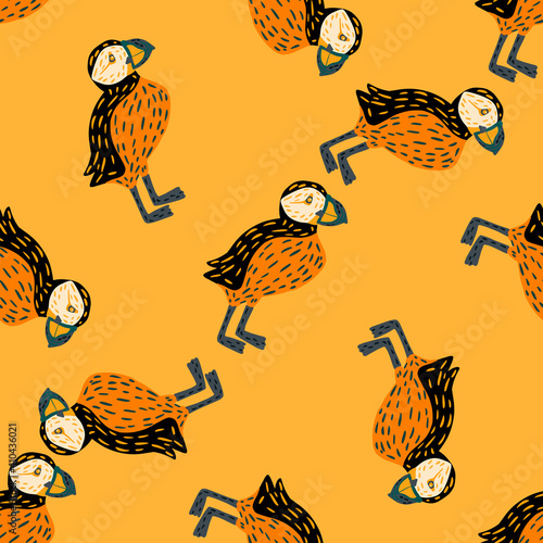 Creative seamless pattern with abstract random puffin bird ornament. Orange and yellow palette colors.