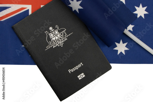 Australian Passport with the Southern Cross flag in the background. Travel, Border Control and Immigration concept. 