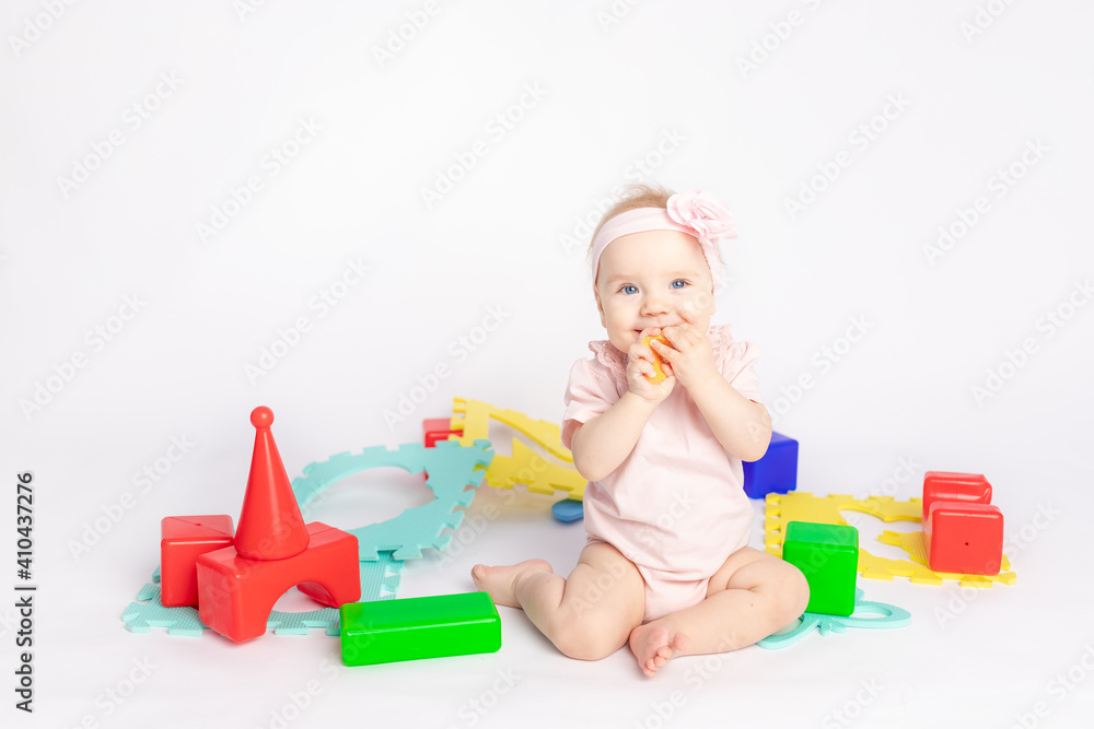 the kid plays with cubes on a white isolated background, space for text the kid plays with cubes on a white isolated background, space for text