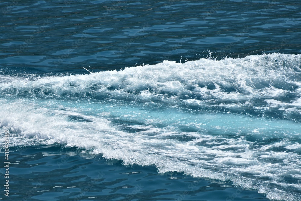 Waves of the sea trail with a foam