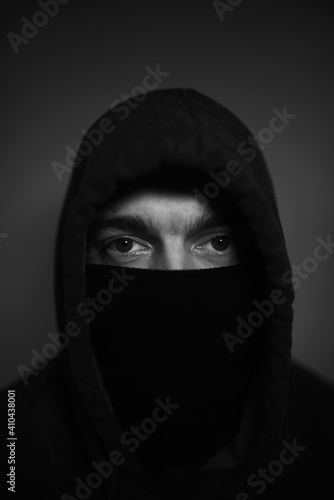 Unknown person.Dark figure in a hooded jacket . Incognito Boy. 