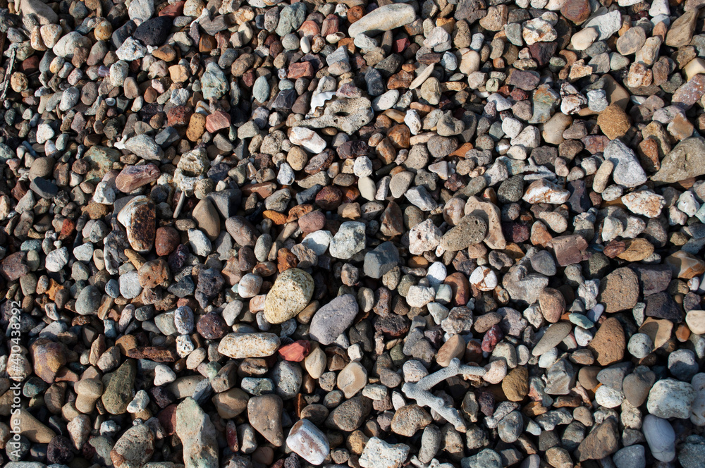 Naklejka premium Natural pebble stone as background 