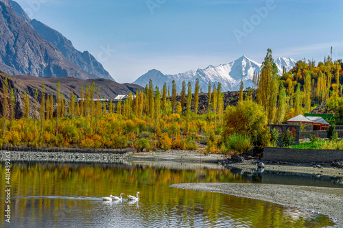 khalti lake in autumn with snow capped mountains in background  photo