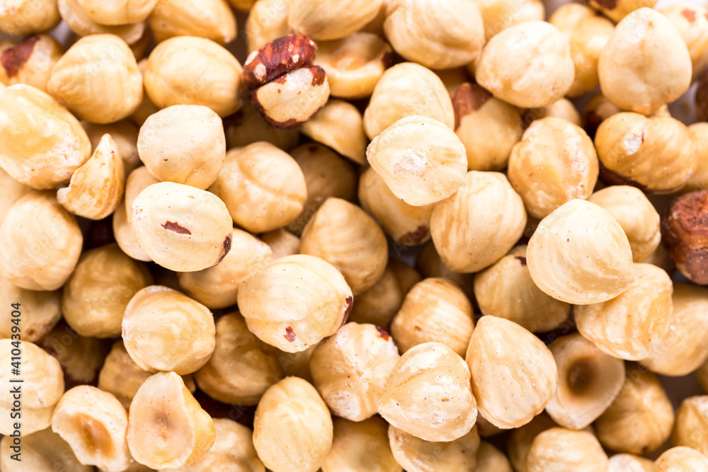 Background of big raw peeled hazelnuts, situated arbitrarily. Background of big raw peeled hazelnuts, situated arbitrarily.