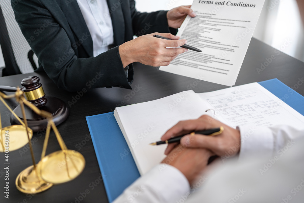 Lawyer discuss the contract and legal document agreement in office. Law and legal concept. Lawyer discuss the contract and legal document agreement in office. Law and legal concept.