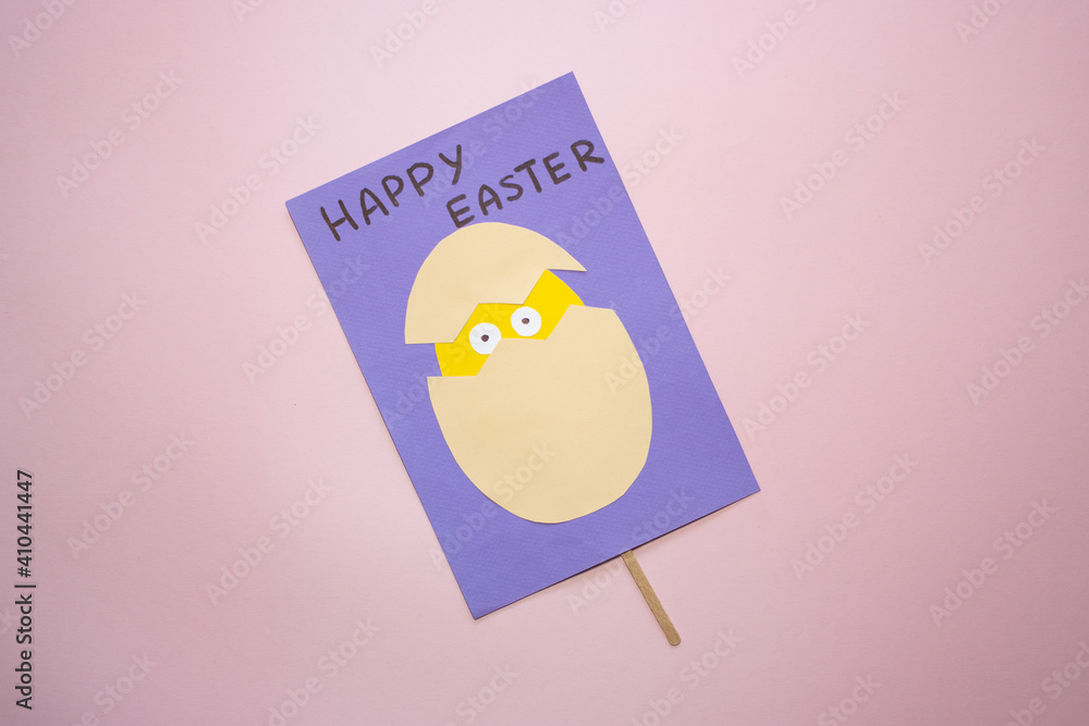 Fototapeta premium Easter greeting card in egg shape. How to make children's paper craft. Step 13. Simple creative art project. Step by step instructions. Homemade easy paper applications. DIY concept. Final result
