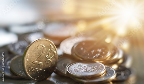 coins rubled in the rays of the sun background