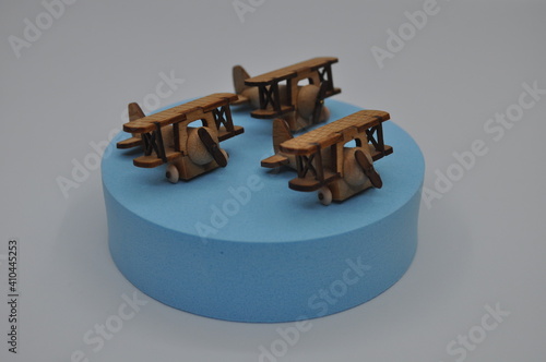 Close up creative shots of small wooden plane models handcrafted from wood, around 3cm X 2cm in size photo