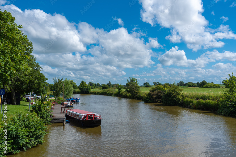 Fototapeta premium Tourist boat at the pier in Greetsiel