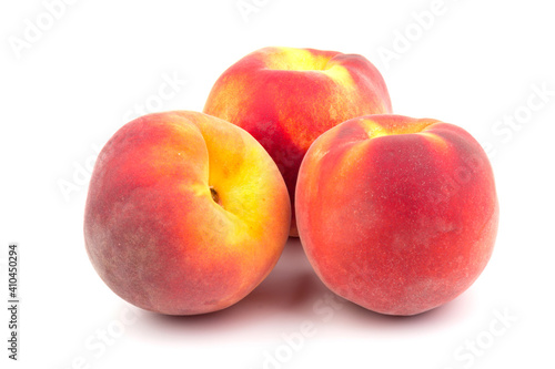 Summer fruit background. Ripe juicy peaches on white background. Copy space. Fresh organic fruit vegan food. Harvest concept