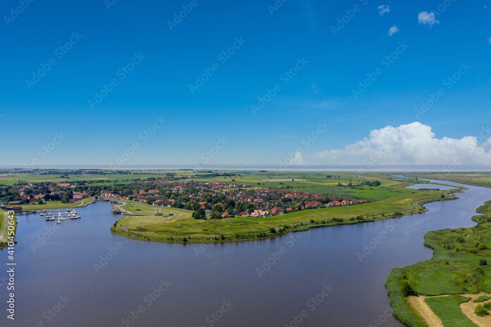 Landscape with view over Greetsiel to the North Sea
