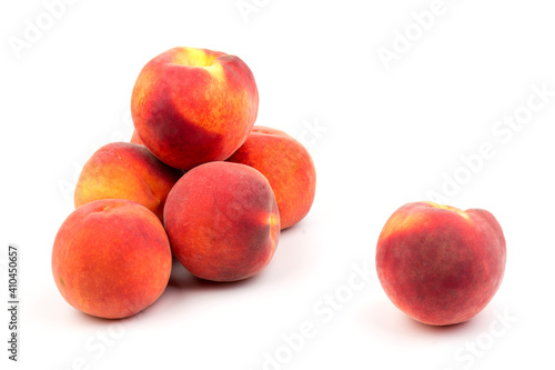 Summer fruit background. Ripe juicy peaches on white background. Copy space. Fresh organic fruit vegan food. Harvest concept © Olga