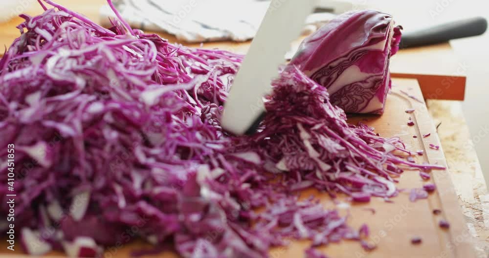 custom made wallpaper toronto digitalRed cabbage cut into thin slices using kitchen mandoline slicer, sauerkraut making process, close up