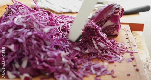 Wallpaper Mural Red cabbage cut into thin slices using kitchen mandoline slicer, sauerkraut making process, close up Torontodigital.ca