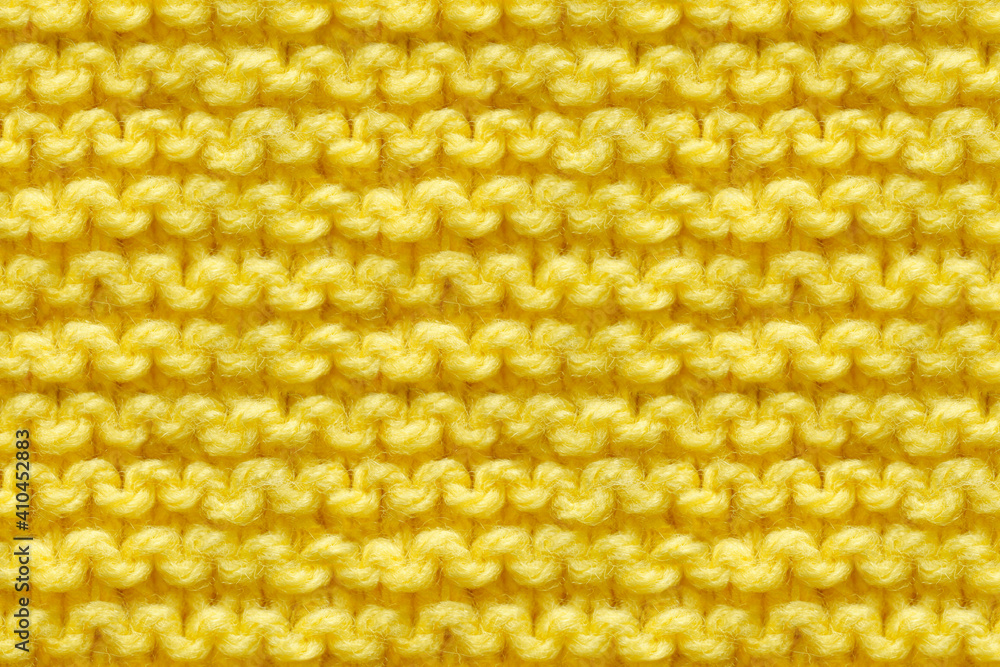 Yellow Knitwear Fabric Texture. Machine Knitting Texture Macro Snapshot. Knitted Background. Yellow Knitwear Fabric Texture. Machine Knitting Texture Macro Snapshot. Knitted Background.