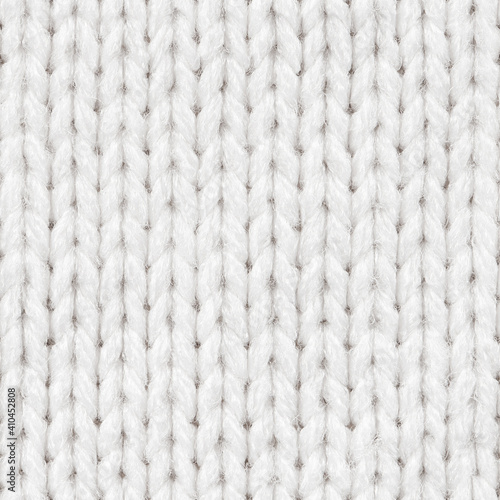 White knitted fabric seamless pattern for borderless fill. Knitted fabric repeating pattern for background close up.