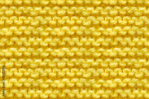 Yellow Knitwear Fabric Texture. Machine Knitting Texture Macro Snapshot. Knitted Background.
