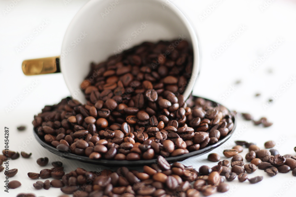 roasted coffee beens inside the coffee mug roasted coffee beens inside the coffee mug