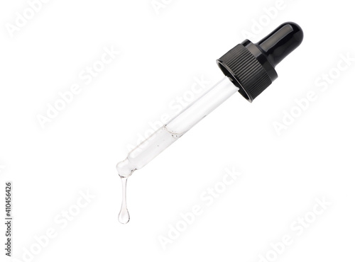 Foto Clear essential oil dripping from dropper  isolated on white background