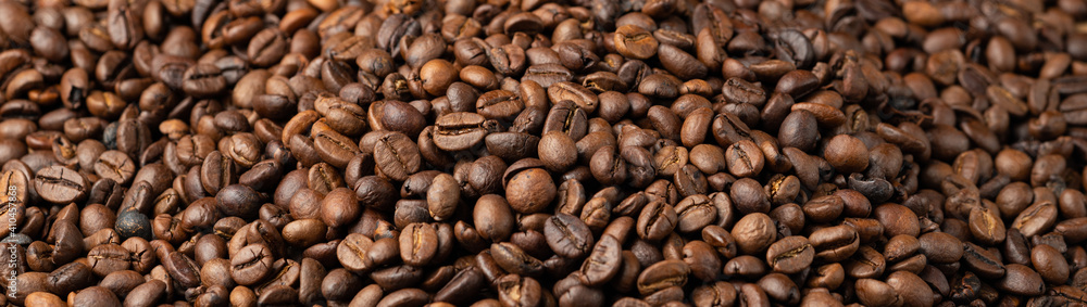 Roasted coffee beans background. Selective focus, macro, banner Roasted coffee beans background. Selective focus, macro, banner