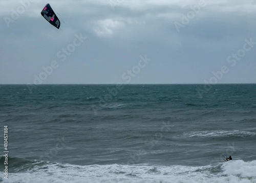 kite surfer riding the waves in the sea