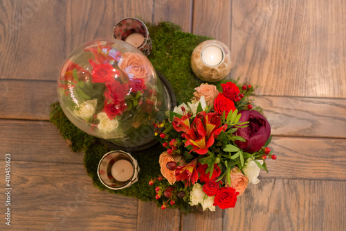 Composition of flowers on a wooden table. Florist work.