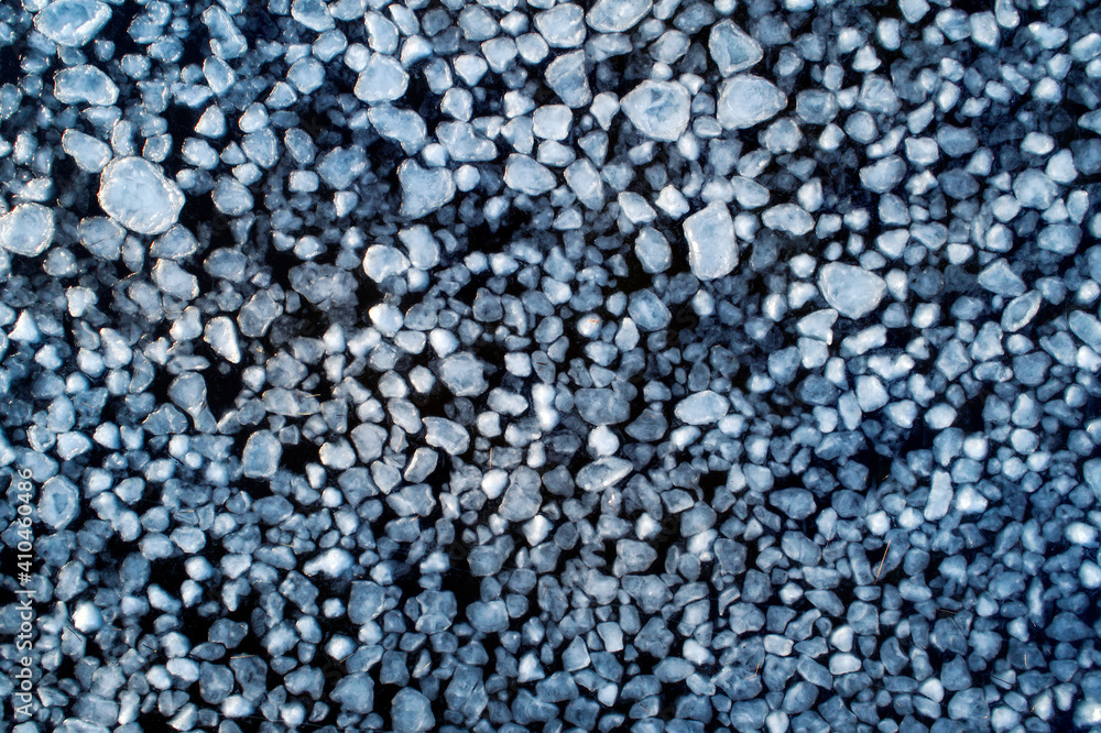 Frozen ice on as a background, a bird's-eye view. Textured surface Frozen ice on as a background, a bird's-eye view. Textured surface