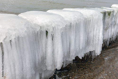 coastal protection groynes covered with ice at the Baltic Sea