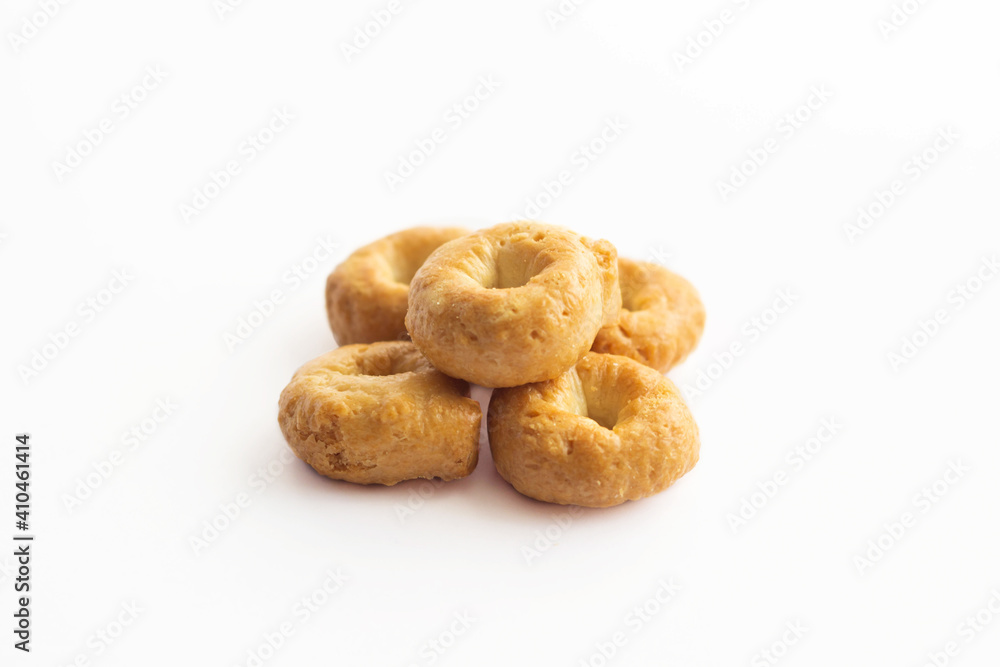 Traditional italian tarallini snack from wheat dough isolated on white background