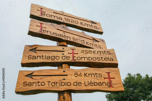 Señales en un cruce del Camino de Santiago que indica al peregrino las distancias a Santiago de Compostela, Santo Toribio de Liébana, Jerusalén y Roma. Norte de España.  photo