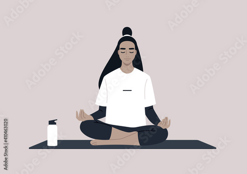 Young calm female Asian character meditating in a lotus yoga pose, mindful lifestyle concept