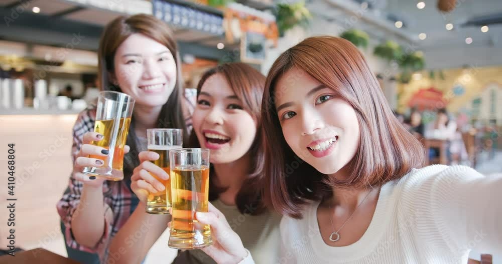 friends toast beer in restaurant friends toast beer in restaurant
