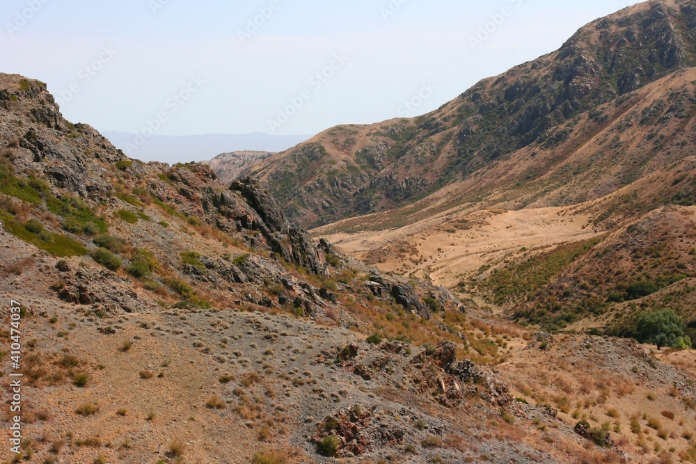 Bektau-Ata Tract. Bektau mountains. Rock formations in Bektau Ata in Kazakhstan in summer. Desert mountains Bektau-Ata. Focus on mountains Bektau-Ata Tract. Bektau mountains. Rock formations in Bektau Ata in Kazakhstan in summer. Desert mountains Bektau-Ata. Focus on mountains