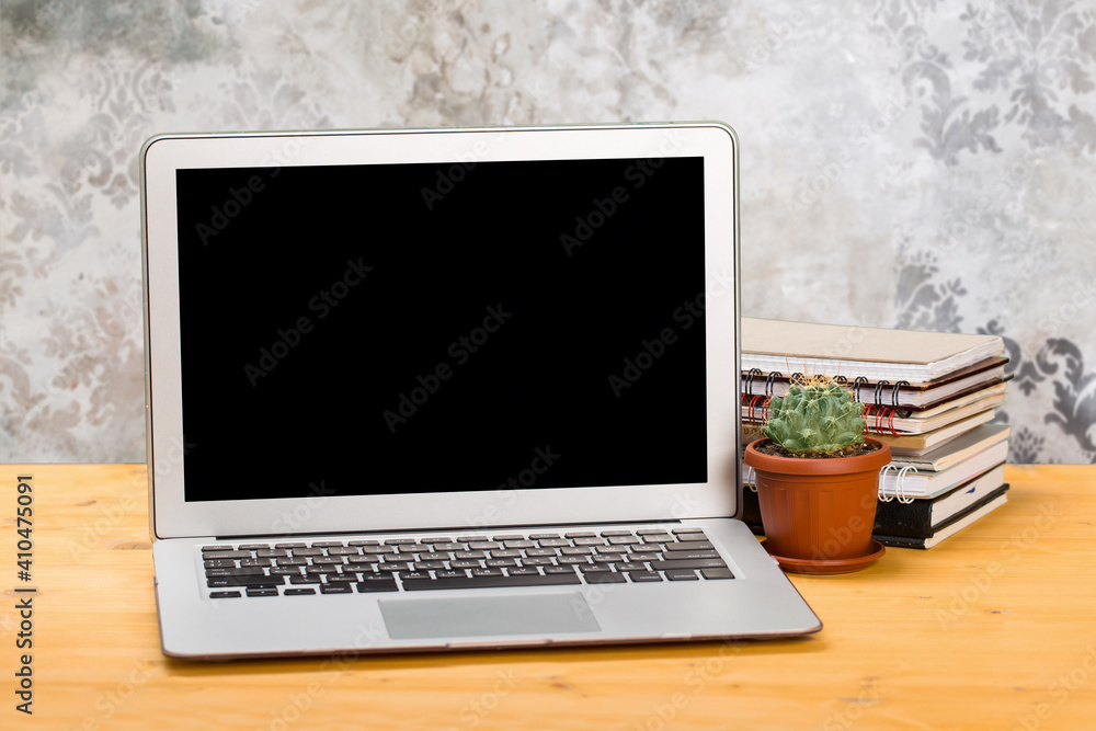 Notebook with notebooks and green succulent on a wooden table. mockup for text Notebook with notebooks and green succulent on a wooden table. mockup for text