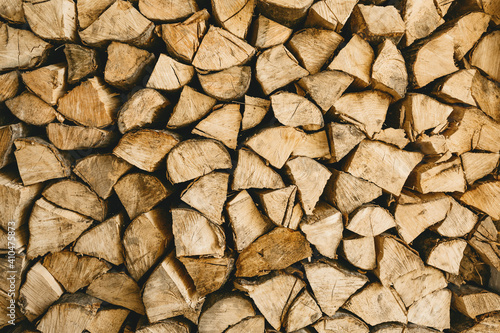 Lots of firewood or wood logs rustic background texture.