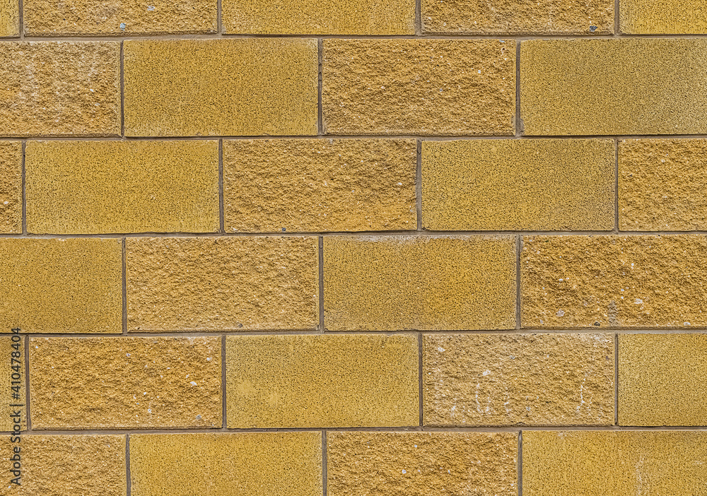 Fototapeta premium Wall with sand colored bricks