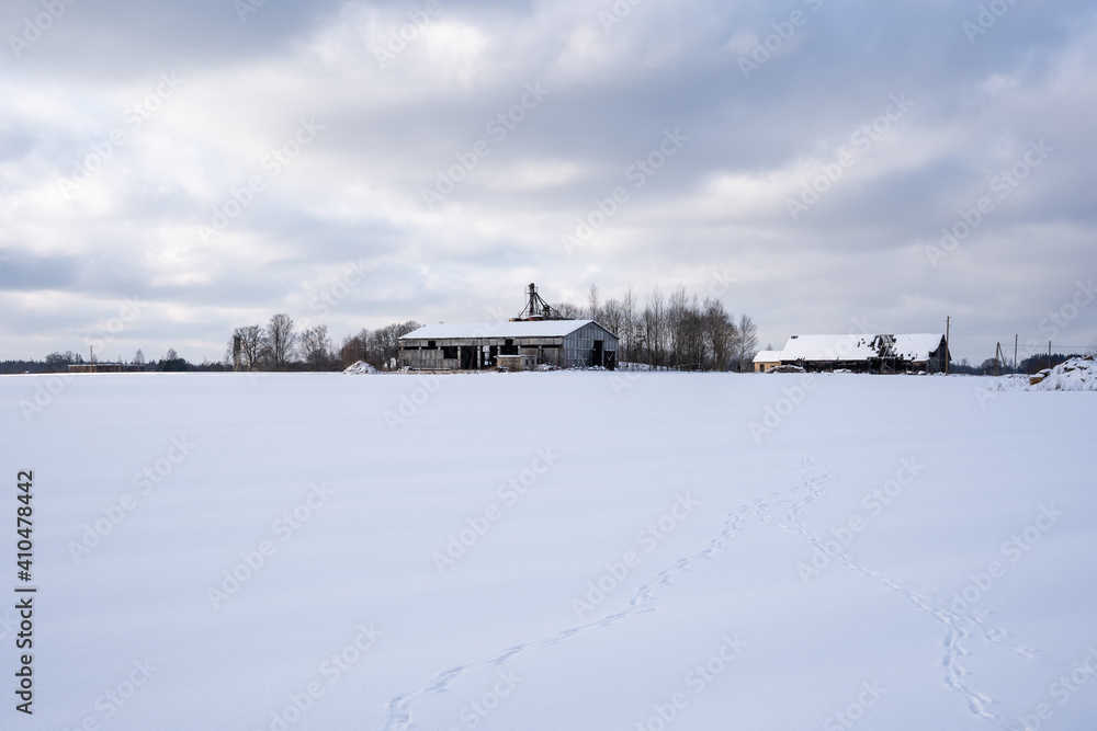 abandoned Soviet-era buildings on a snowy winter day when the sun is shining abandoned Soviet-era buildings on a snowy winter day when the sun is shining