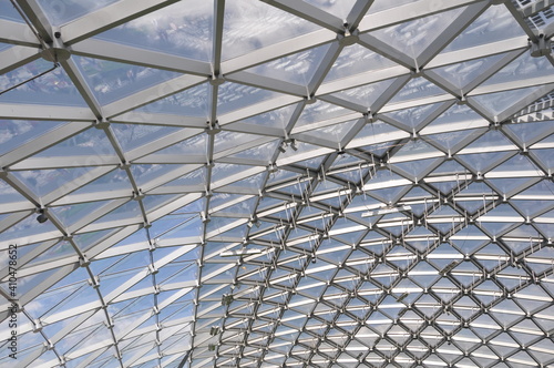 Modern pavilion roof made of glass and metal. Construction.