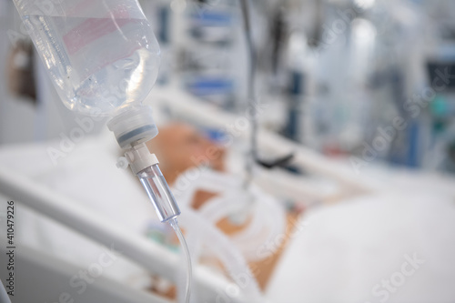 Nurse is preparing intravenous medication in intensive care unit.