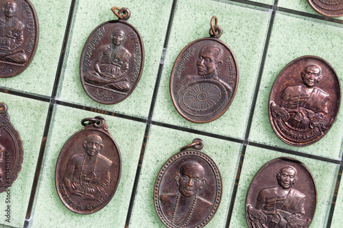 Obraz na płótnie Phra Khuva Boonchum coins , Small Buddha image or Thai amulet w salonie