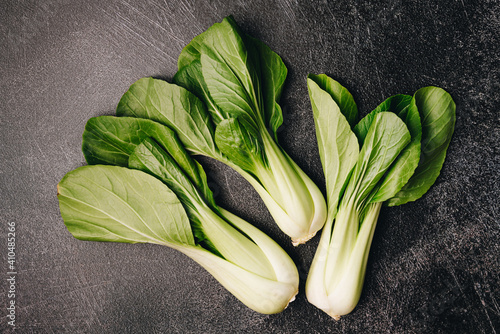 Foto Pak Choi, pok choi, bok choy, fresh green Chinese cabbage on dark background