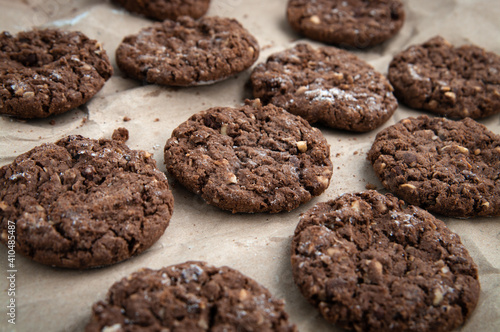 Homemade sweet chocolate cookies on baking paper.