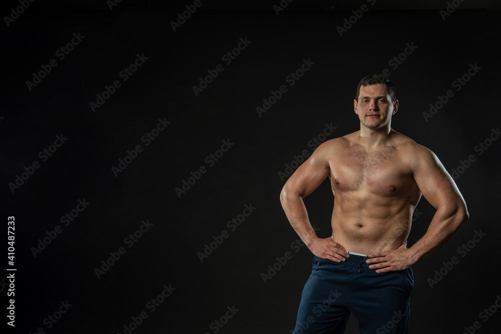 Fototapeta premium Man hands on waist bare torso Young male business smart, portrait confidence Men content, successful cool background black bodybuilder