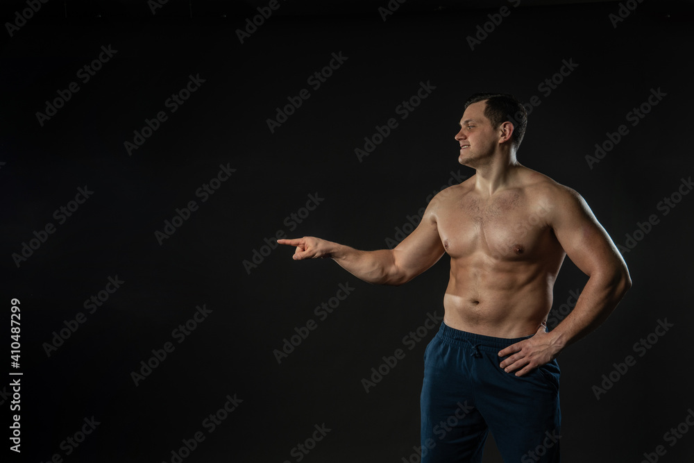 Man's hand points bare torso Young male male fashion, torso casual background. Elegant models, successful cool background black bodybuilder Man's hand points bare torso Young male male fashion, torso casual background. Elegant models, successful cool background black bodybuilder