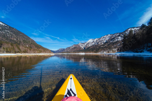 Stand up paddling through icy mountain lake © Martin Naujocks