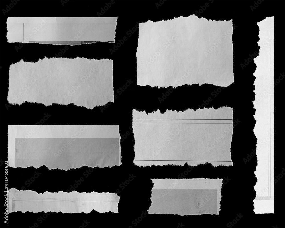 Torn papers on black