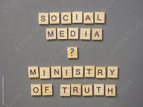 Words social media ministry of truth on gray background.
