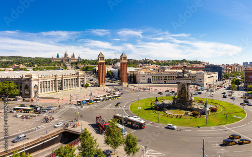 Aerial rooftop view of Placa d'Espanya or Plaza de Espana or Spanish Square and Fountain Of Montjuic in summer sunny day. National Museum of Art on background. Barcelona - capital of Catalonia, Spain